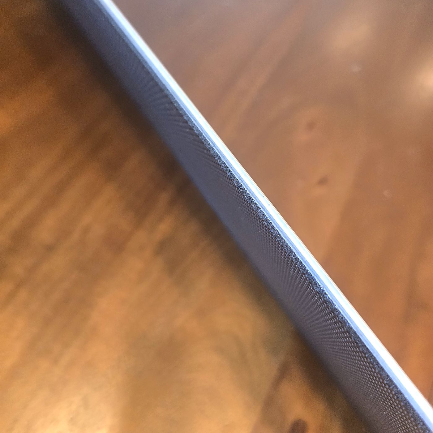 Side profile of a Soundstop plank showing the wear surface and attached acoustic pad