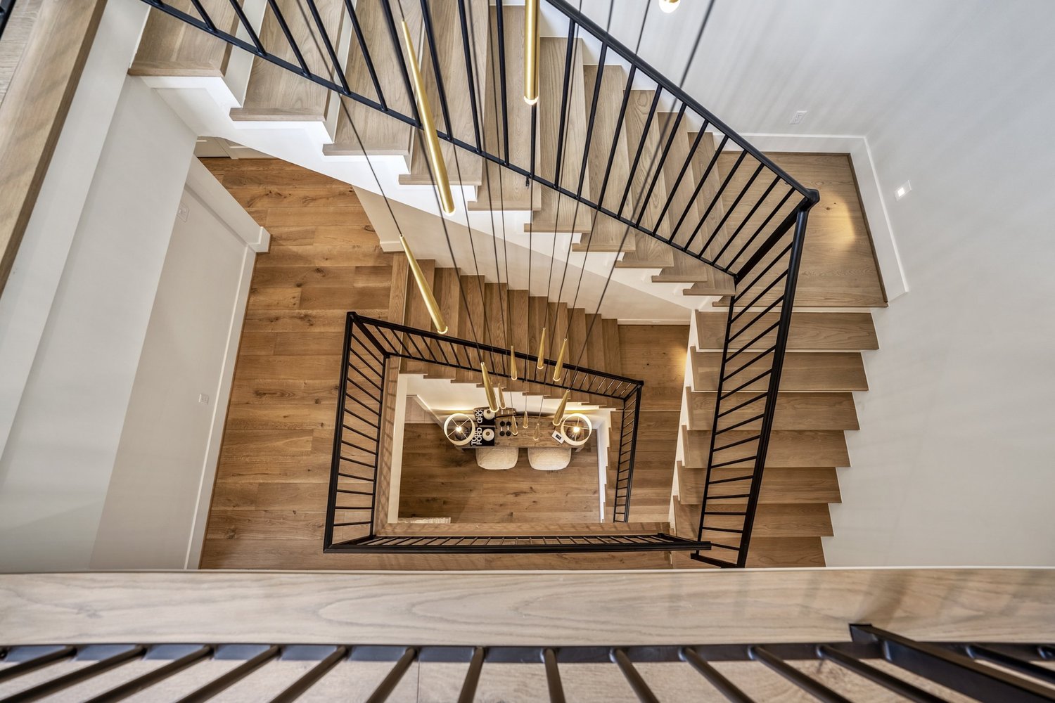 Curved spiral staircase in Bora Bora European white oak, Wine Country–inspired modern home